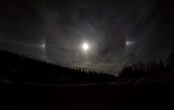 Moon halo with bright spots.